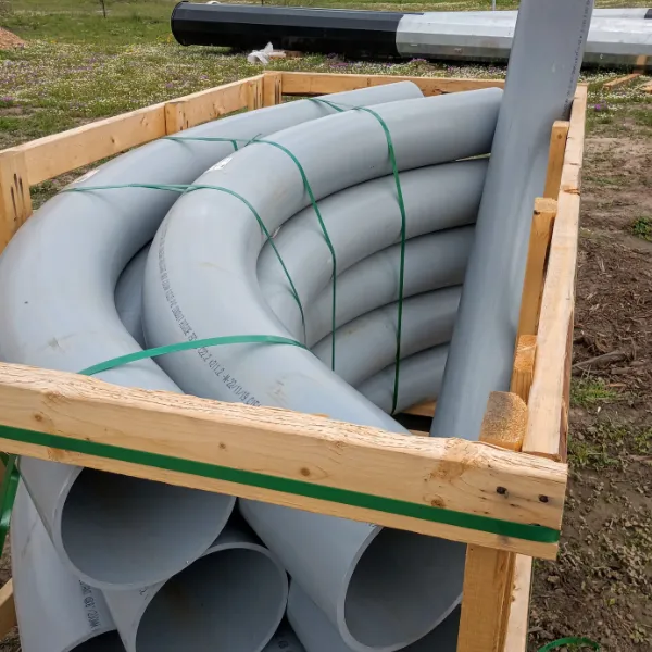 Crate full of 6 in PVC conduit elbows