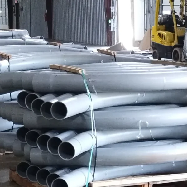 Pallets of PVC elbows in warehouse
