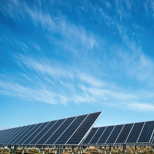 Blue sky background with solar panels in foreground